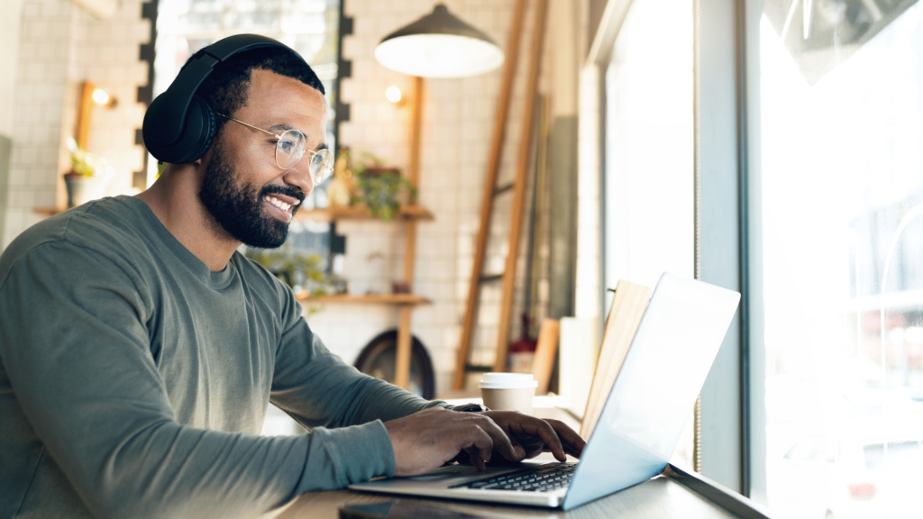 Smiling remote worker with headphones